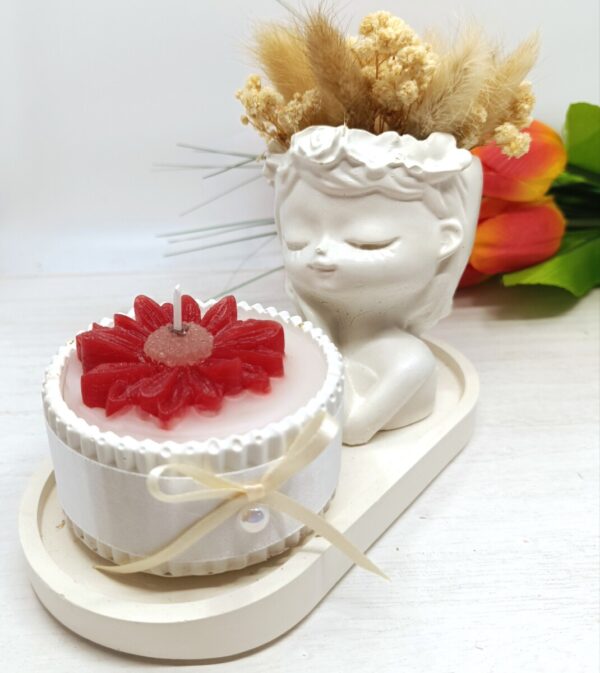 podstavek s kipcem in diseco sveco